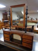 A stained pine mirrored shelf