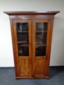 An early 20th century mahogany glazed bookcase