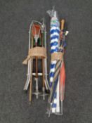 Two bundles of assorted walking sticks,