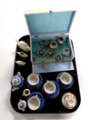 A tray containing boxed Fabrique Francaise miniature tea set, willow pattern blue and white tea set,