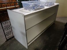 A large serving counter with storage beneath