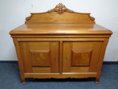 A mid century light pine sideboard