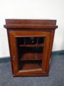 An Edwardian mahogany smoker's cabinet with glazed door