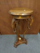 A reproduction plant stand together with a brass framed chair