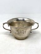A silver twin handled cup, weight 110.