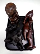 A tray containing two African carved figures,