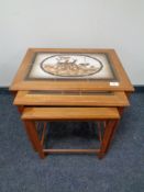 A nest of three 20th century Mobel Fabrikken Danish teak tile topped tables