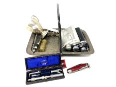 A silver plated swing handled basket together with silver plated cup, three hip flasks,