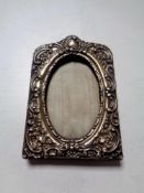 An embossed silver photo frame,