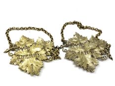 A very fine pair of ornate large silver gilt decanter labels, heavily cast for Sherry and Port,