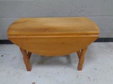 An oak drop leaf coffee table