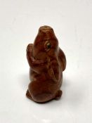 A carved Chinese hardwood netsuke - large rabbit