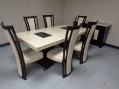 A contemporary simulated marble rectangular dining table together with matching three door