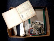 A large box of mixed ephemera including photographs, military prints,