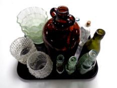 A tray containing bottles bearing various names including one bottle marked W B Reid and Co.