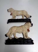 A pair of painted cast iron dog door stops