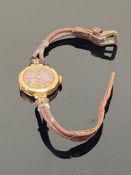 An early twentieth century wrist watch with 9ct gold case