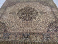 A machine made Persian design carpet,