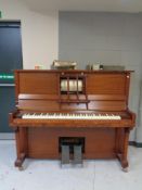 An overstrung pianola together with a small quantity of rolls