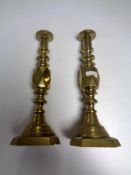 A pair of Victorian brass candlesticks