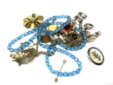 A small quantity of costume jewellery, brooches,