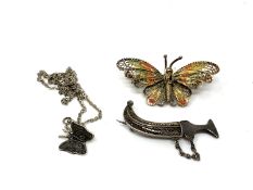 A silver filigree butterfly brooch together with a further butterfly on chain