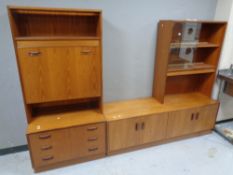 A 20th century teak modular sideboard fitted cupboards and drawers