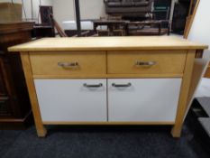 A contemporary kitchen sideboard fitted drawers and cupboards beneath