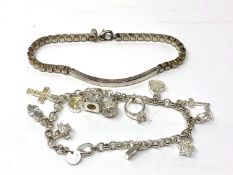 A white metal charm bracelet together with a further bracelet