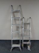 An aluminium folding ladder together with a similar extension ladder