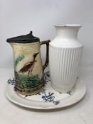 A nineteenth century K & Co Apple Blossom plate together with an English Majolica jug and a Hornsea