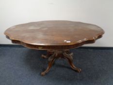 A 19th century shaped walnut dining table