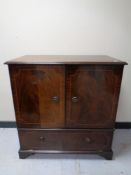 A reproduction inlaid mahogany TV cabinet