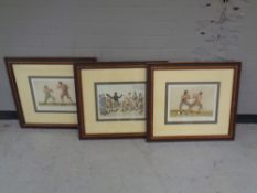A set of three framed boxing prints