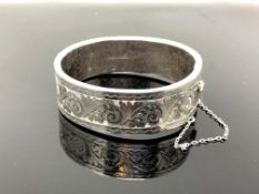 An engraved silver bangle CONDITION REPORT: 29.
