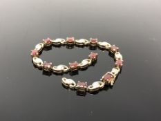 A 9ct gold gem set bracelet (broken). CONDITION REPORT: 10.