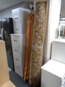 A machine made floral carpet on beige ground, together with a further striped contemporary rug.