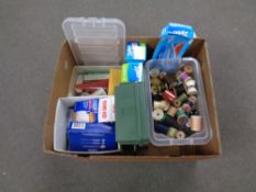 A box of miscellany to include first aid items, scissors, zip lock bags, sewing threads etc.
