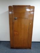 A twentieth century oak single door wardrobe