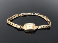 A lady's 9ct gold Helvetia wristwatch on 9ct gold strap. CONDITION REPORT: 11.