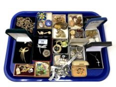 A tray containing antique and later costume jewellery, silver crucifix pendant, silver locket etc.