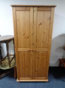 A pine double door wardrobe