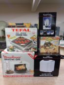 A Russell Hobbs bread maker and coffee percolator together with a Moulinex mini chef grill,