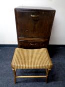 A 20th century John Carter double door record cabinet together with a gold Lloyd Loom dressing