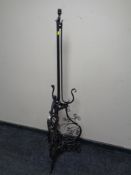 A wrought metal standard lamp.