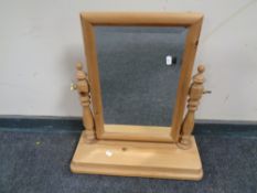 A pine dressing table mirror.