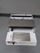 A commercial food sealer.
