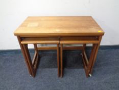 A twentieth century teak G-plan turn over top trolley fitted with two tables