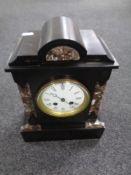 A 19th century black slate and marble mantel clock with enamelled dial.