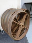 A set of four cast iron cart wheels